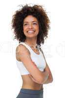 Smiling fit young woman with arms crossed