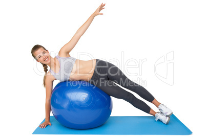 Portrait of a fit woman stretching on fitness ball Portrait of a fit woman stretching on fitness ball