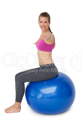 Fit young woman exercising on fitness ball Fit young woman exercising on fitness ball