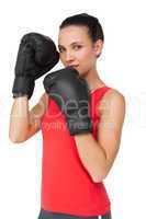 Portrait of a determined female boxer focused on her training