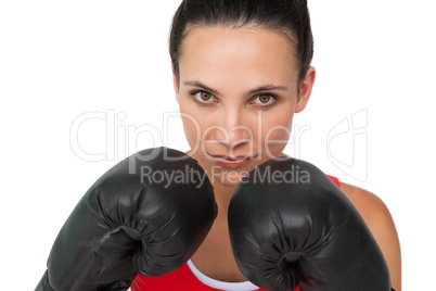 Close-up portrait of a determined female boxer