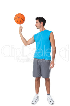 Full length of a basketball player with ball