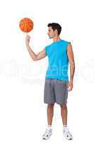 Full length of a basketball player with ball