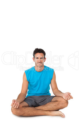 Full length portrait of a sporty young men in lotus pose