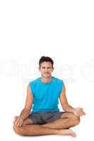 Full length portrait of a sporty young men in lotus pose