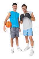 Two fit men with boxing gloves and basketball