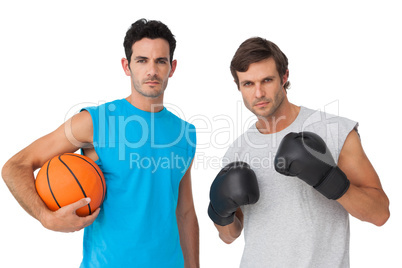 Fit men with boxing gloves and basketball