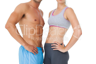 Mid section of a fit young couple