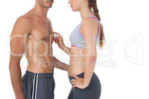 Side view mid section of a fit young couple