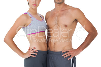 Mid section of a fit young couple