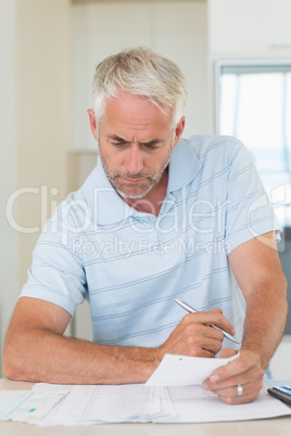 Focused man working out his finances