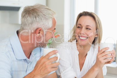 Happy couple having coffee together