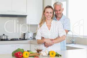 Affectionate couple preparing a healthy dinner together