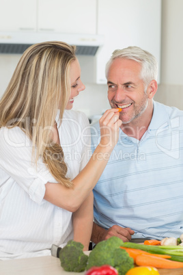 Happy couple preparing dinner together