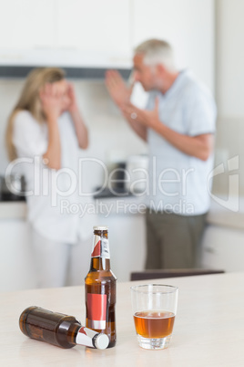 Angry couple arguing after drinking alcohol