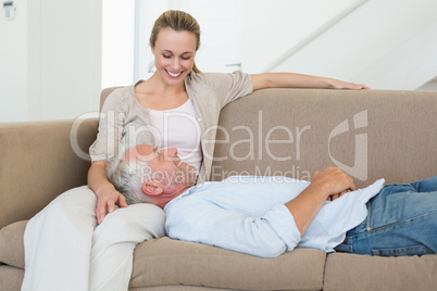 Happy couple relaxing on the couch together