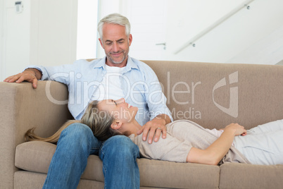 Happy couple relaxing on the couch together