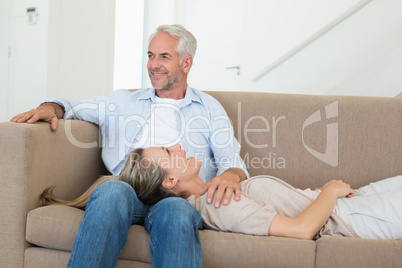 Happy couple relaxing on the couch together