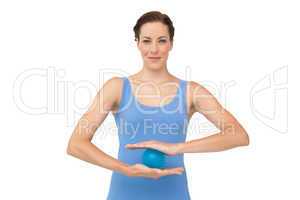 Portrait of a content young woman holding stress ball