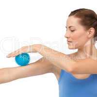 Portrait of a young woman holding stress ball on arm