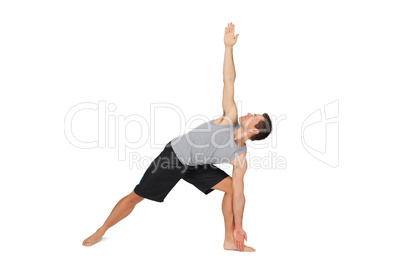Full length of a young man stretching hand to leg
