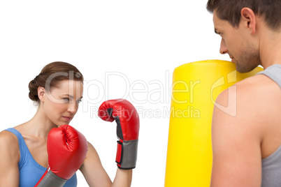 Determined female boxer focused on her training