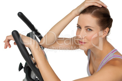 Close-up portrait of a beautiful young woman on stationary bike