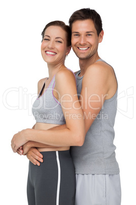 Side portrait of a happy fit young couple