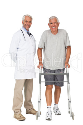 Portrait of a doctor with senior man using walker