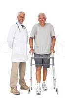 Portrait of a doctor with senior man using walker