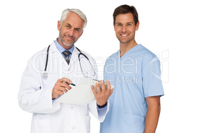 Portrait of male doctor and surgeon with reports