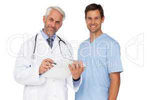 Portrait of male doctor and surgeon with reports