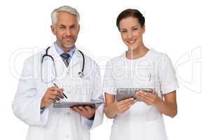 Male and female doctors with digital tablets