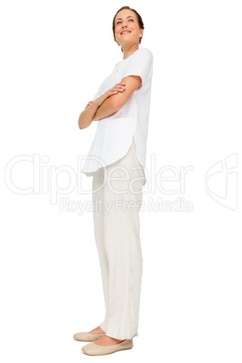 Full length of a female nurse with arms crossed