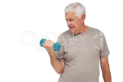 Portrait of a senior man exercising with dumbbell