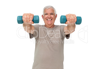 Portrait of a happy senior man exercising with dumbbells