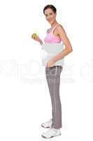 Young woman with weight scale and apple