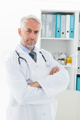 Portrait of a serious confident male doctor at medical office Portrait of a serious confident male doctor at medical office