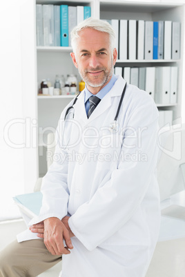 Portrait of a confident male doctor at medical office Portrait of a confident male doctor at medical office