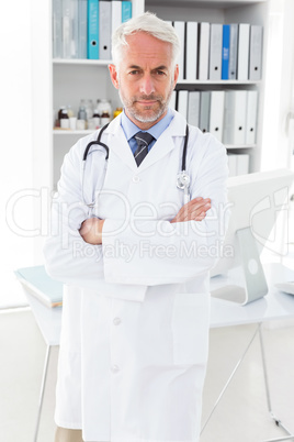 Portrait of a serious confident male doctor at medical office