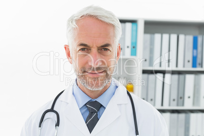 Smiling confident male doctor at medical office Smiling confident male doctor at medical office
