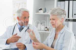 Female senior patient visiting doctor