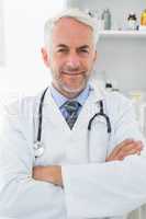 Portrait of a smiling male doctor at medical office