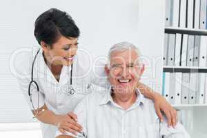 Portrait of a female doctor with happy senior patient