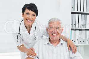 Female doctor with happy senior patient
