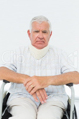 Senior man sitting in wheelchair with cervical collar