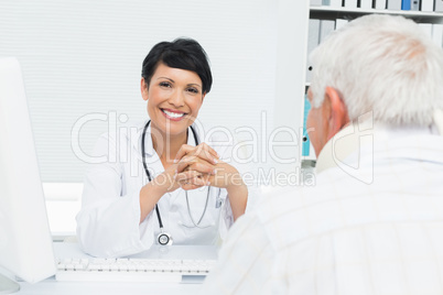 Portrait of a smiling female doctor with senior patient