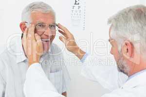 Man wearing glasses after taking vision test at doctor