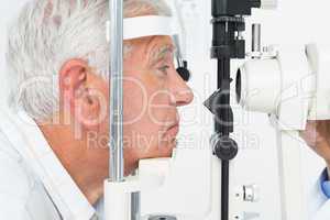 Senior man getting his cornea checked