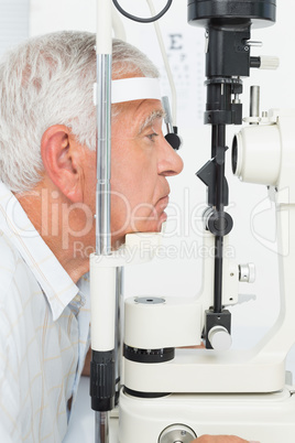 Senior man getting his cornea checked